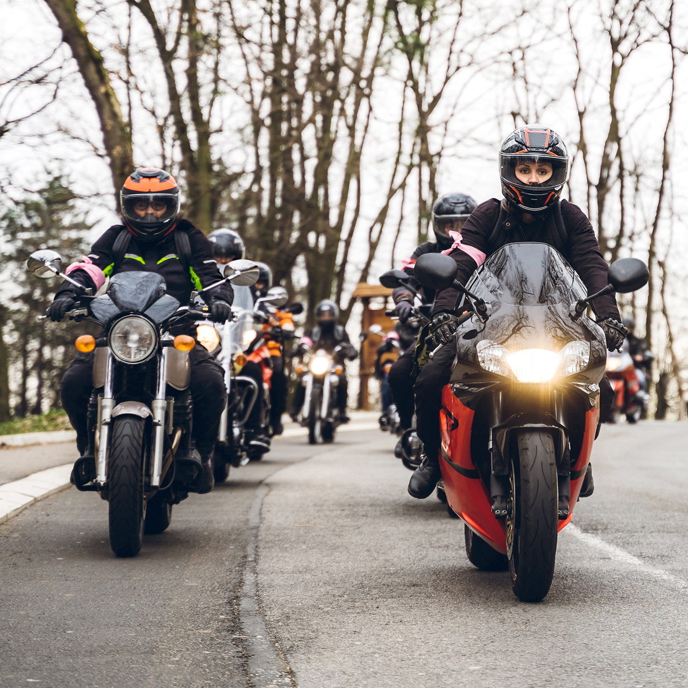 a group of motorcycle riders out on the road